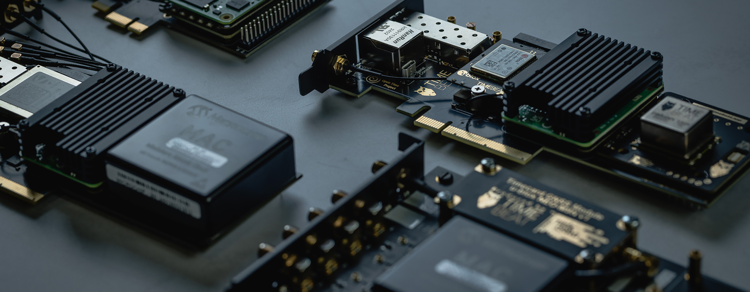 Timebeat timing hardware and circuit boards on a dark surface